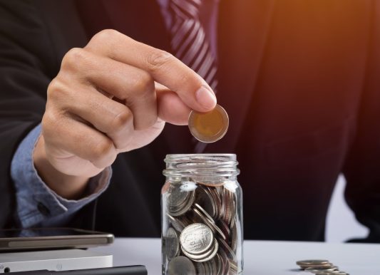 hand-putting-mix-coins-seed-clear-bottle-copyspace-business-investment-growth-concept-min hand-putting-mix-coins-seed-clear-bottle-copyspace-business-investment-growth-concept-min